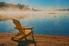 Canada-Ontario-Silent Lake Provincial Park. Muskoka chair and morning fog on Silent Lake. Art Print